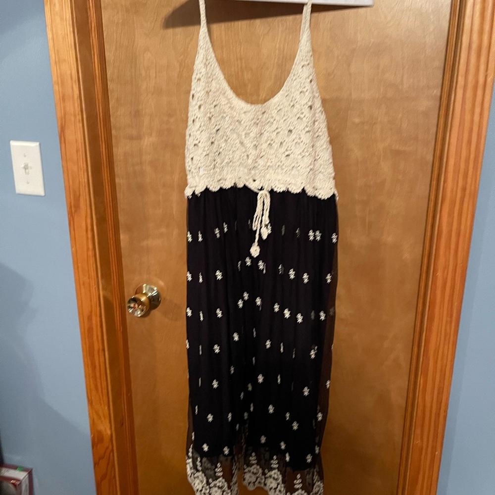 NWT sleeveless black dress with knitting at the top.